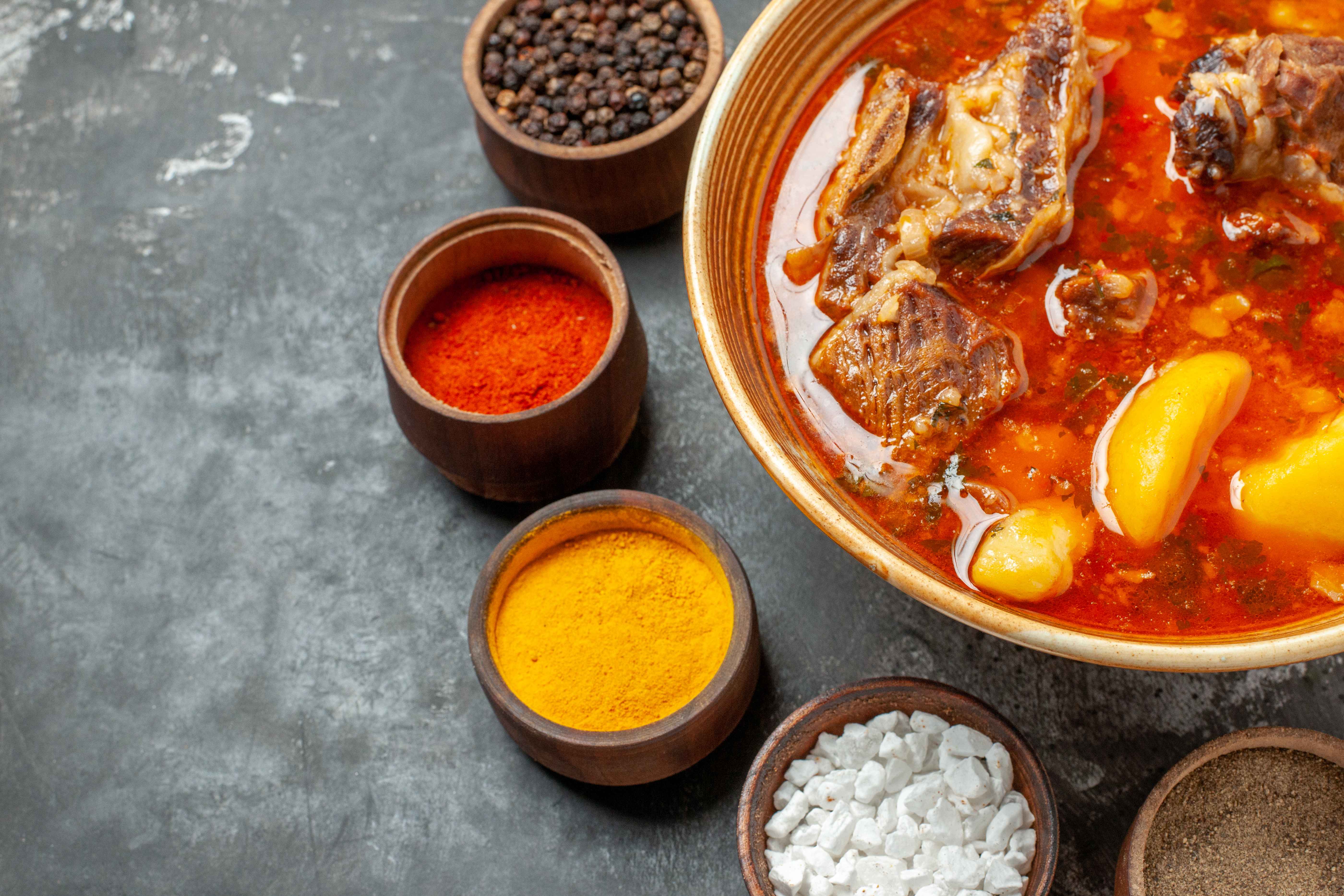 top-view-delicious-meat-soup-with-different-seasonings_11zon